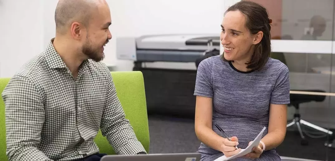man-woman-office-discussion-wide (1)